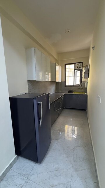 Kitchen in 2 BHK Builder Floor at Palm Residency Chhatarpur, Rajpur Khurd Extension – for Rent