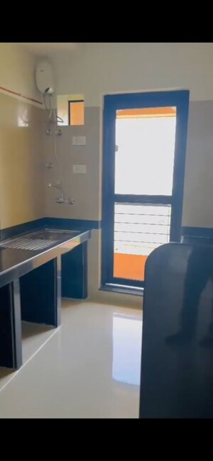 Kitchen in 2 BHK Apartment at Raheja Interface Heights, Malad West – for Rent