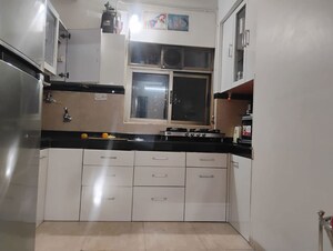 Kitchen in 2 BHK Apartment at Twinkle Towers CHS, Kailash Nagar – for Sale