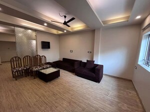 Living Room in 1.5 BHK Apartment at Ambience Mall, Sector 24 – for Rent