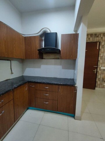 Kitchen in 2 BHK Apartment at Apex Golf Avenue, Sector 1 Greater Noida – for Rent