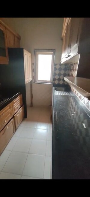 Kitchen in 2 BHK Apartment at Bandstand Apartment, Bandra West – for Rent