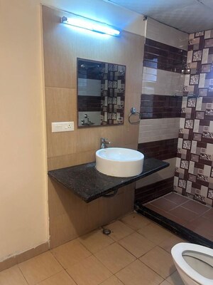 Bathroom in 4 BHK Apartment at Mahagun Maple, Sector 50 – for Rent