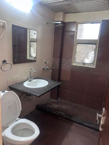 Bathroom in 4 BHK Apartment at Mahagun Maple, Sector 50 – for Rent