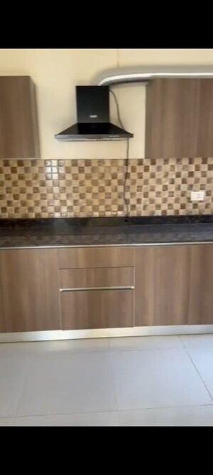 Kitchen in 4 BHK Apartment at Adani Oyster Arcade, Sector 102 – for Rent