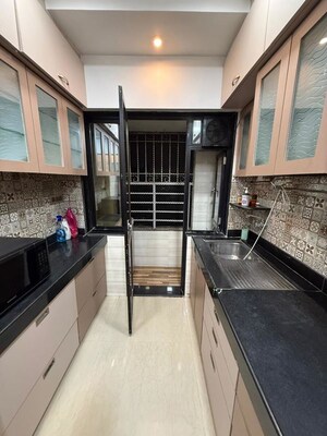 Kitchen in 1 BHK Apartment at Monarch CHS, Andheri East – for Sale