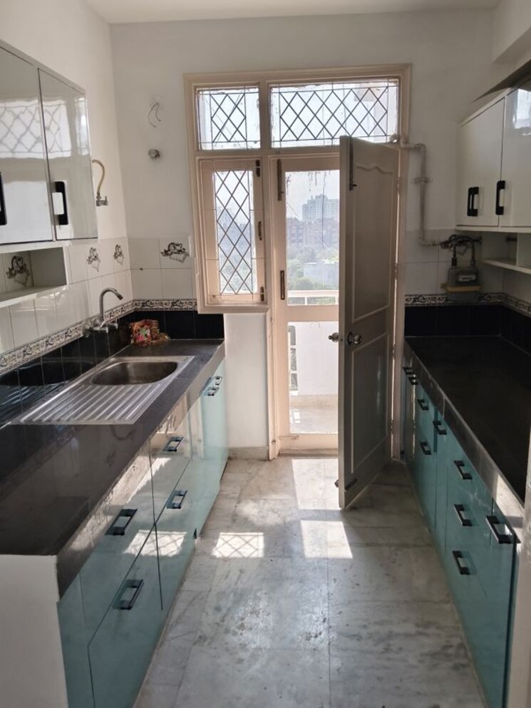 Kitchen, royal-towers-noida 4 Bedroom 2400 Sq.Ft. Apartment In Sector 61 Noida 9980498