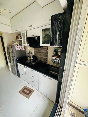 Kitchen in 2 BHK Apartment at Unique Poonam Estate Cluster 3, Mira Road – for Sale