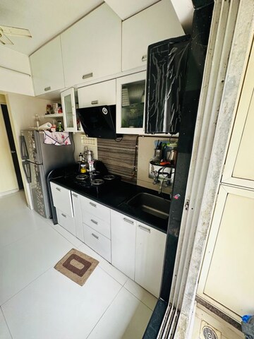 Kitchen in 2 BHK Apartment at Unique Poonam Estate Cluster 3, Mira Road – for Sale