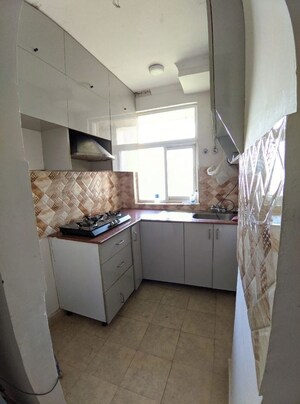 Kitchen in 2 BHK Apartment at Amrapali Leisure Park, Amrapali Leisure Valley – for Rent