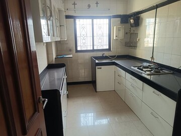 Kitchen in 2 BHK Apartment at Serenity Heights, Malad West – for Rent