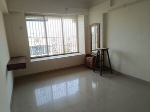 Room in 2 BHK Apartment at Serenity Heights, Malad West – for Rent