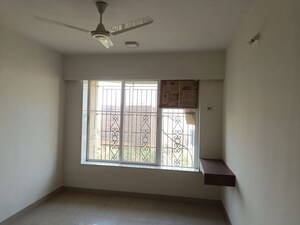 Room in 2 BHK Apartment at Serenity Heights, Malad West – for Rent