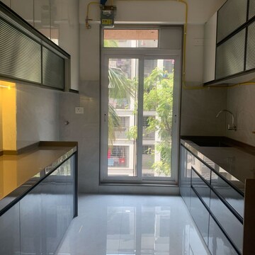 Kitchen in 3 BHK Apartment at Rander Komal Kounteya CHS, Prerna Nagar – for Sale
