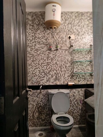 Bathroom in 3 BHK Apartment at Orchid Petals, Sector 49 – for Sale