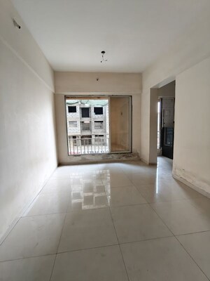 Living Room in 1 BHK Apartment at Seven Eleven Apna Ghar II, Mira Road – for Sale