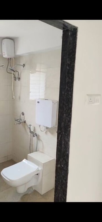 Bathroom in 2 BHK Apartment at Tanishque Harsh Kusum Residence, Dadar West – for Rent