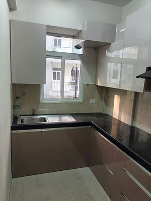 Kitchen in 2 BHK Apartment at Signature Global Orchard Avenue, Sector 93 – for Rent