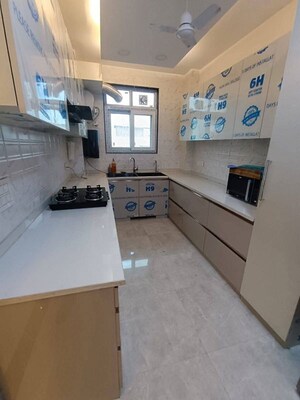 Kitchen in 1.5 BHK Apartment at Ambience Creacions, Sector 22 – for Rent