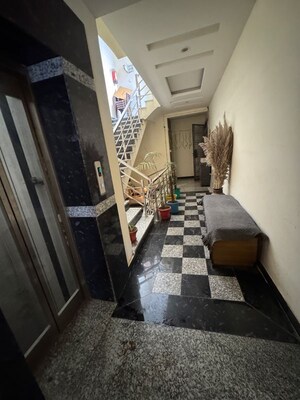 Living Room in 2 BHK Apartment at Palm Residency Chhatarpur, Rajpur Khurd Extension – for Rent