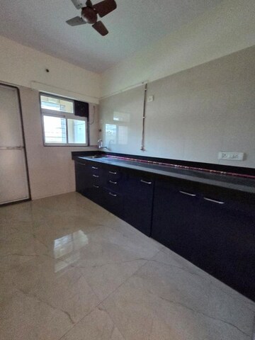 Kitchen in 2 BHK Apartment at Cosmos Habitat, Majiwada – for Rent