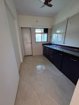 Kitchen in 2 BHK Apartment at Cosmos Habitat, Majiwada – for Rent