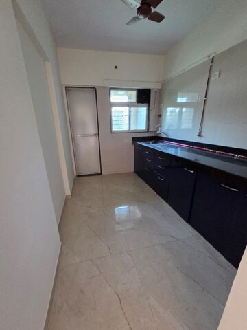 Kitchen in 2 BHK Apartment at Cosmos Habitat, Majiwada – for Rent