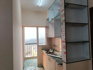 Kitchen in 1 BHK Apartment at Amrapali Dream Valley – for Rent