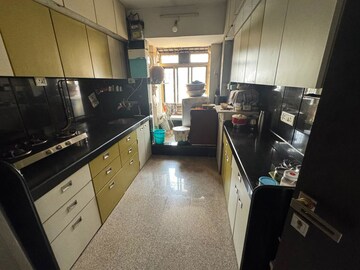 Kitchen in 2 BHK Apartment at Prarthana CHS, Goregaon West – for Rent