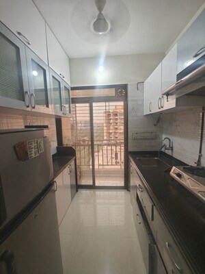 Kitchen in 1 BHK Apartment at Om Prabhu Manohar CHS, Seawoods Sector 50 – for Rent