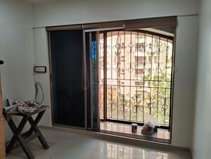 Room in 2 BHK Apartment at Shiv Kutir CHS, Andheri West – for Rent