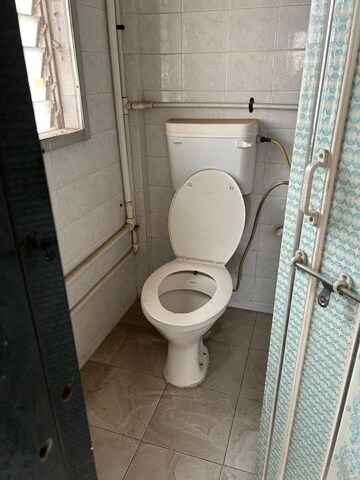 Bathroom in 2 BHK Apartment at Patil Raghukul Nagari CHS, Bopodi – for Sale