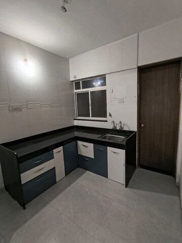 Kitchen in 2 BHK Apartment at Venkatesh Viraj Heights, Dhanori – for Rent