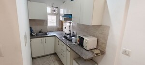 Kitchen in 1 BHK Apartment at Ajnara Elements, Sector 137 – for Rent