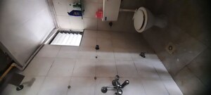Bathroom in 2 BHK Apartment at New Mhada Towers, Andheri West – for Sale
