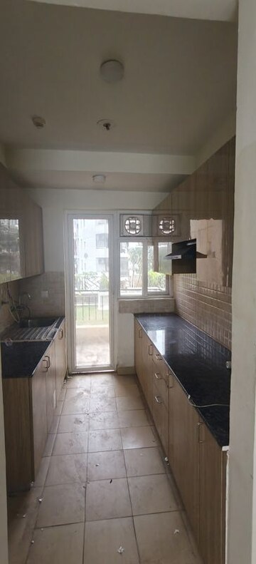 Kitchen in 3 BHK Apartment at Amrapali Crystal Homes, Sector 76 – for Rent