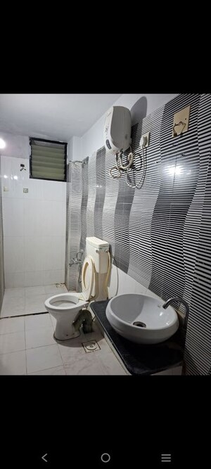 Bathroom in 3 BHK Apartment at Shree Balaji Agora Residency, Sughad – for Rent