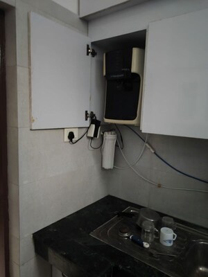 Kitchen in 1 RK Apartment at Arun Vihar, Sector 29 – for Rent