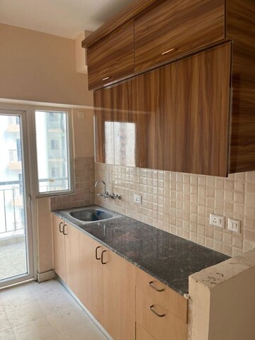 Kitchen in 1 BHK Apartment at Amrapali Dream Valley – for Rent