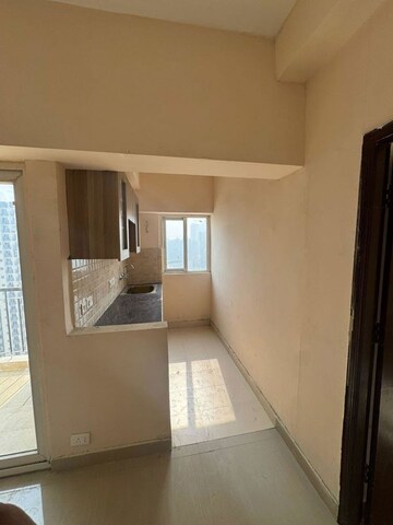 Kitchen in 1 BHK Apartment at Amrapali Dream Valley – for Rent