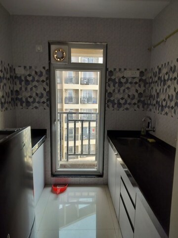 Living Room in 1 BHK Apartment at Raunak Bliss, Ghodbunder Road – for Rent