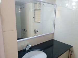 Bathroom in 2 BHK Apartment at Kalpa Taru Siddhachal III, Vasant Vihar – for Rent