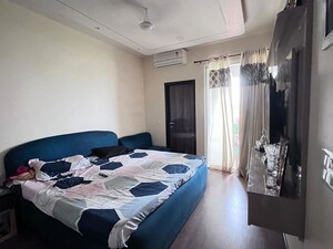 Bedroom in 3 BHK Builder Floor at DLF Gardencity Enclave, Sector 93 – for Rent