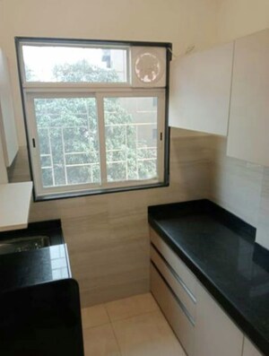 Kitchen in 2 BHK Apartment at Asha Nagar CHS, Mulund West – for Rent