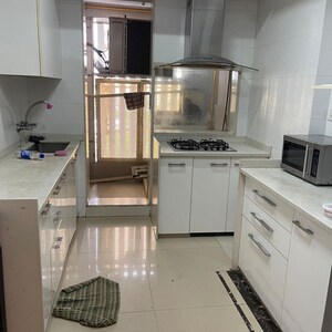 Kitchen in 2 BHK Apartment at Pearl Heights, Yari Road – for Rent