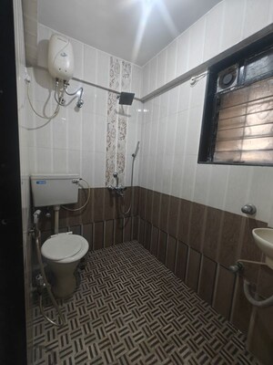 Bathroom in 2 BHK Apartment at Badri Kedar Building, Seawoods Sector 40 – for Rent