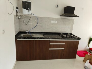 Kitchen in Studio Apartment at Gera World of Joy, Kharadi – for Rent