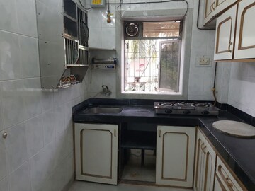 Kitchen in 1 BHK Apartment at Vaishali Nagar CHS, Mulund West – for Sale
