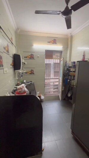 Kitchen in 1 BHK Apartment at Woodland Complex, Naigaon East – for Rent