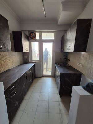 Kitchen in 2 BHK Apartment at Amrapali Heartbeat City, Sector 107 – for Rent
